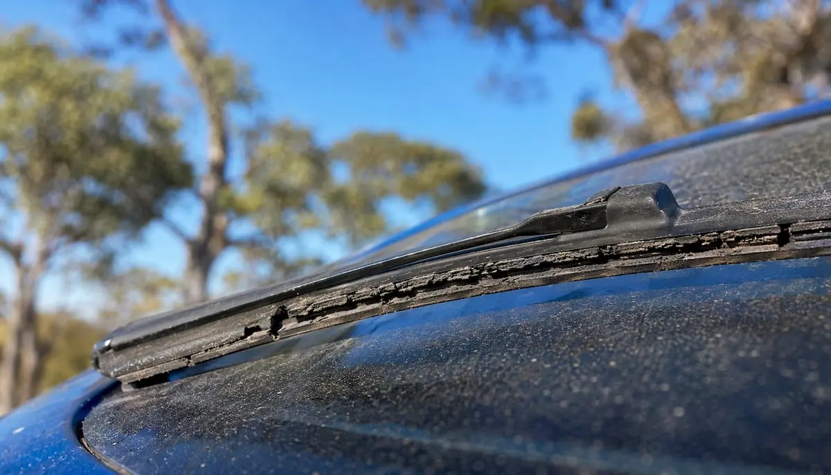 Close-up of worn wiper blade on windscreen