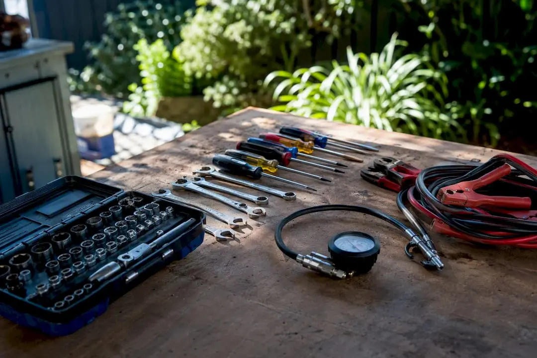 Essential car care tools on garage bench