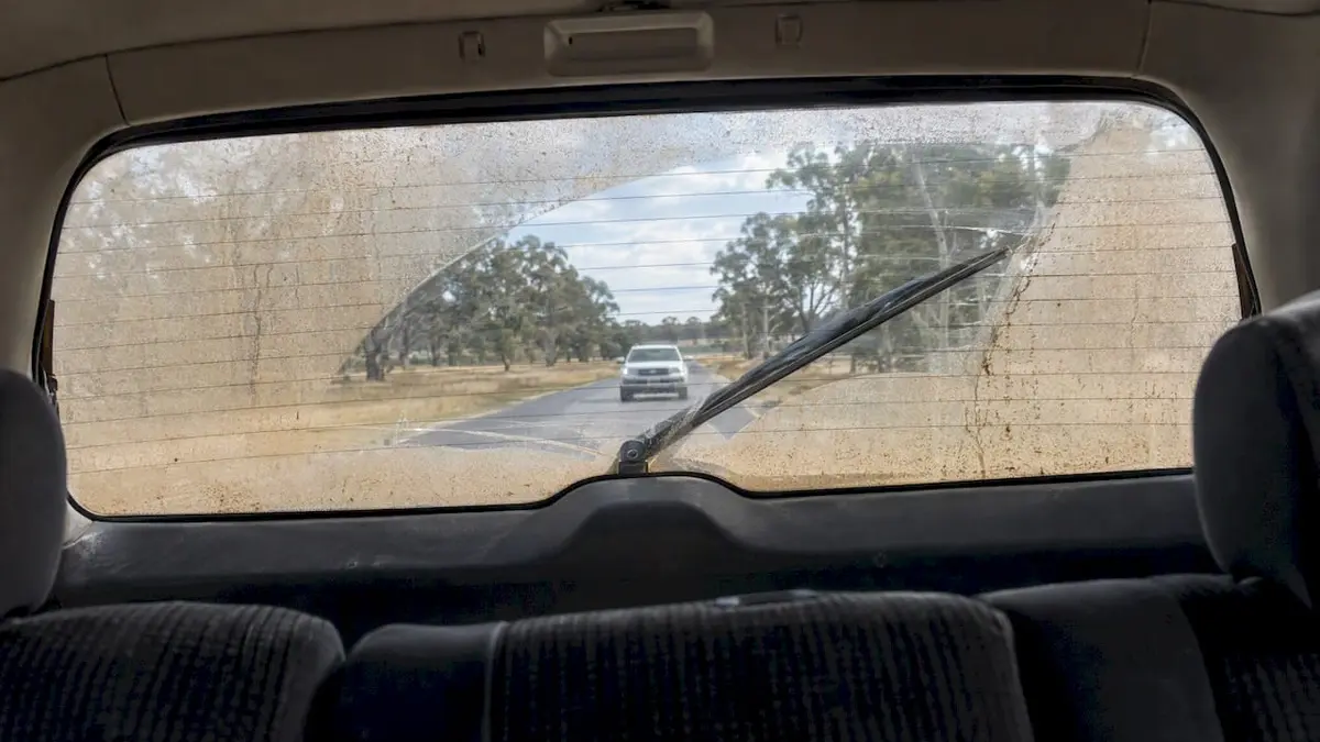 Rear wiper clearing dust from a wagon window